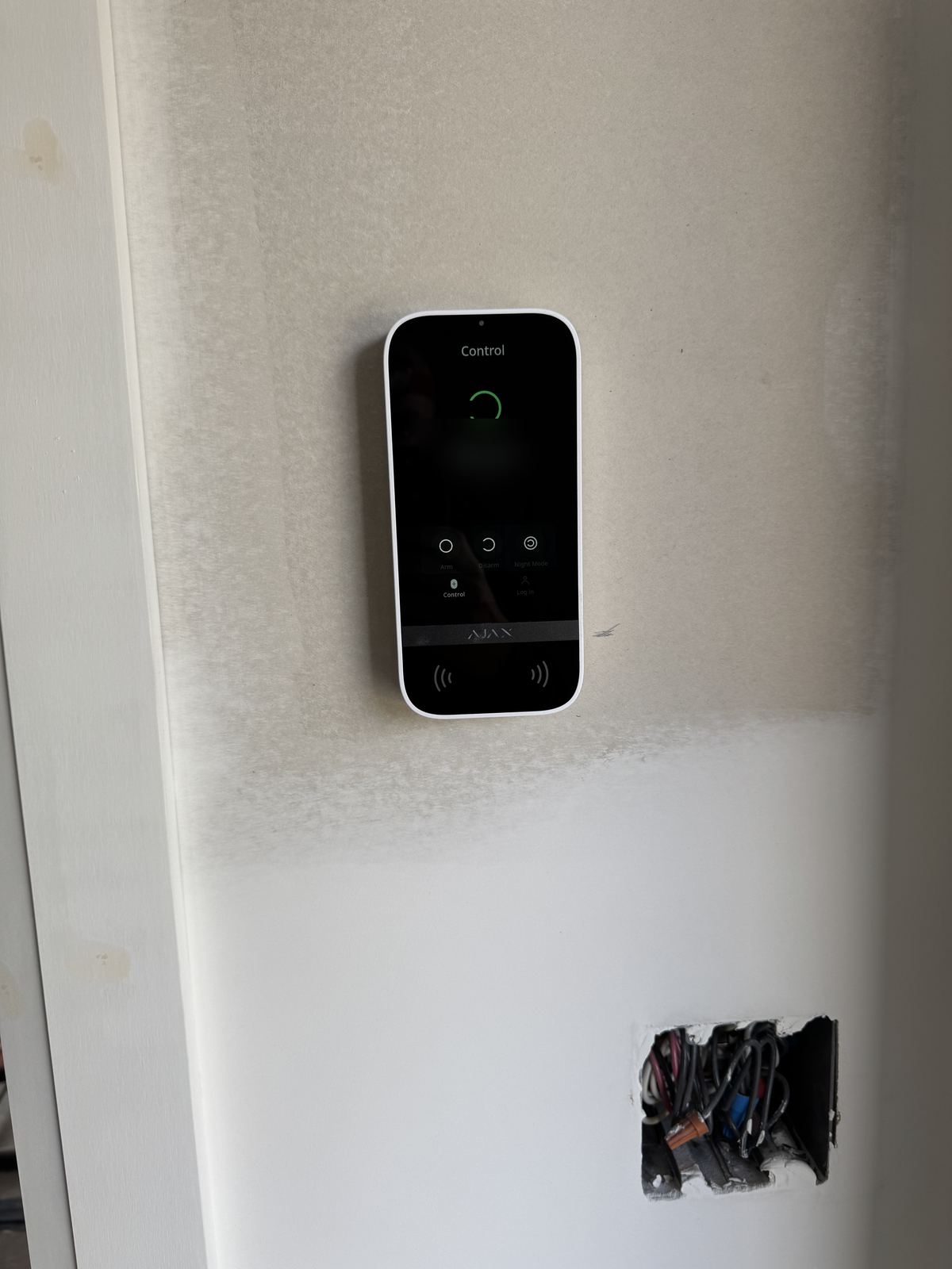 Ajax touchscreen keypad installed at an entry door