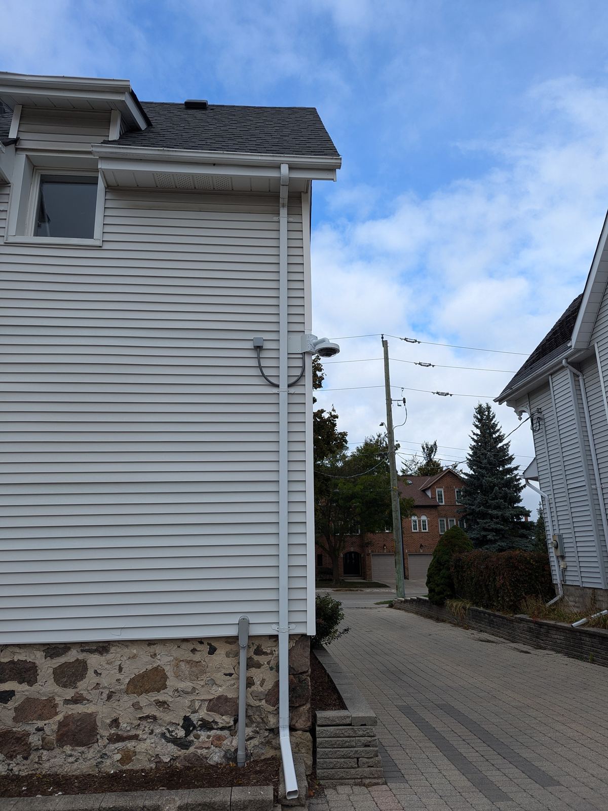Multi-sensor camera covering a side yard and driveway