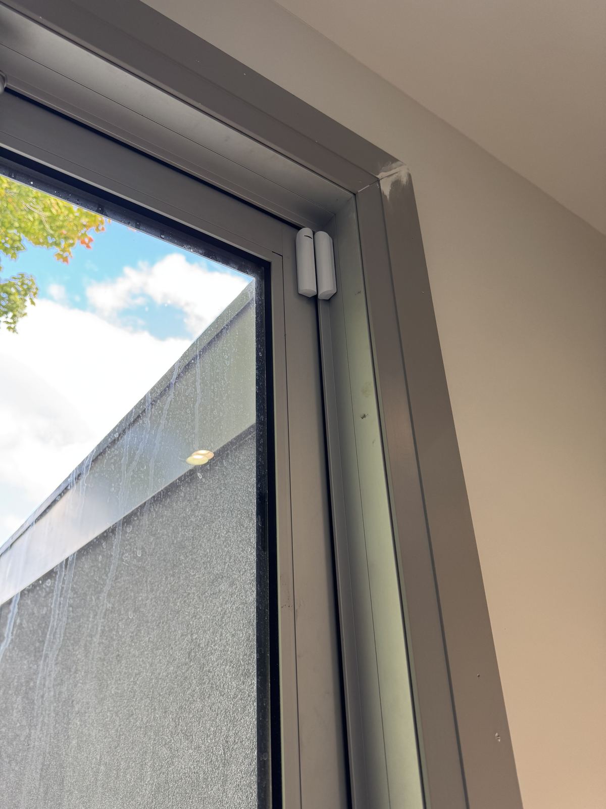 Ajax door contact sensor on a window frame