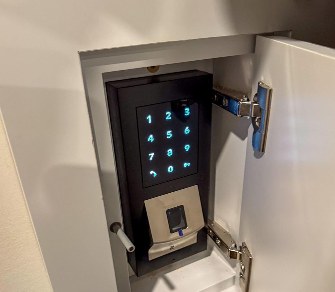 Hidden 2N keypad with fingerprint reader inside a wall cabinet