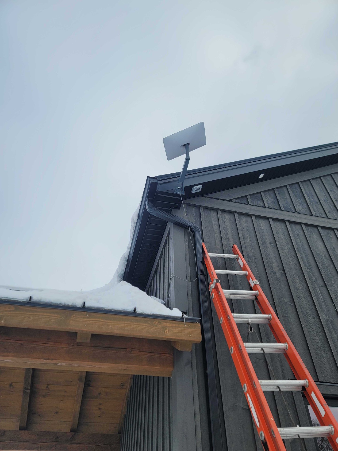 Exterior television mount installation in winter conditions