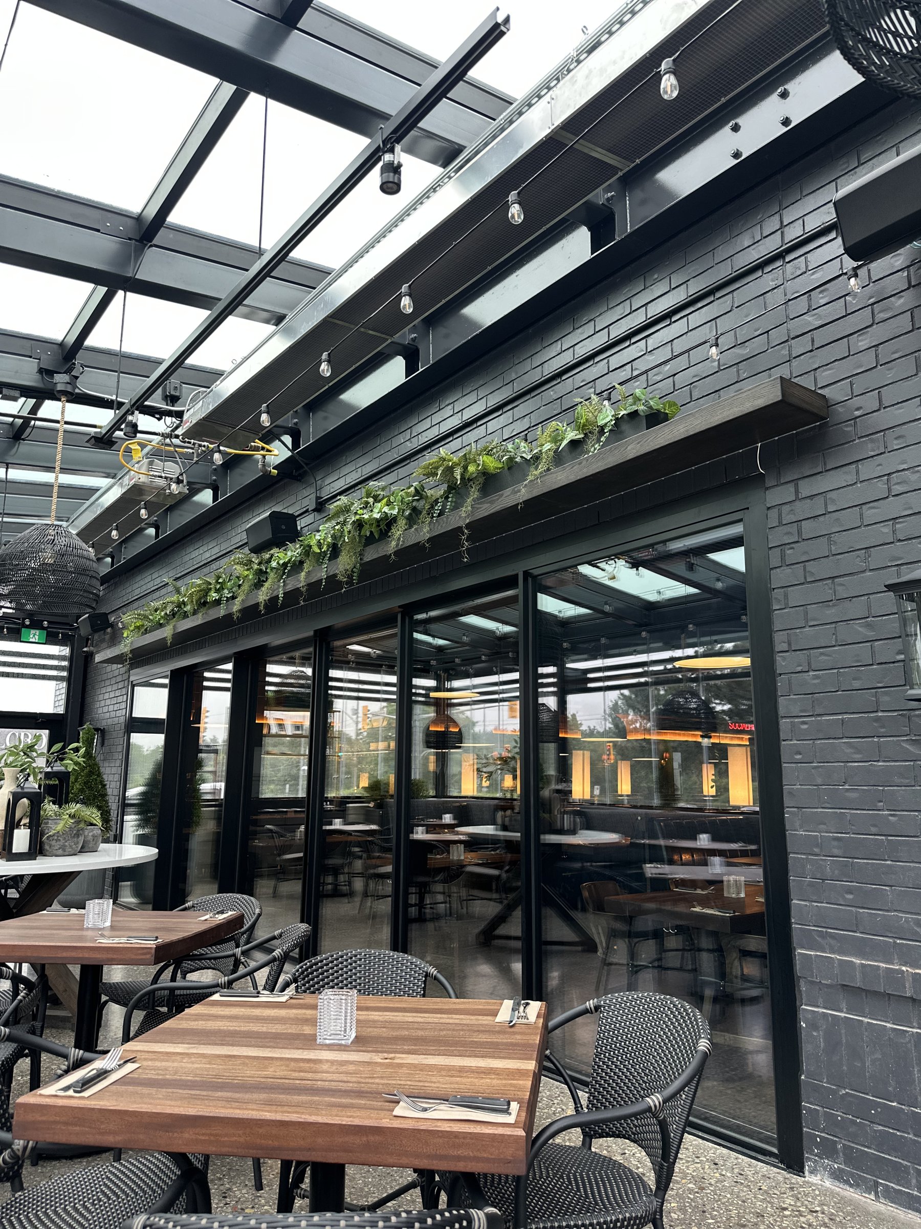 Restaurant seating area with programmed scene lighting and automated shades