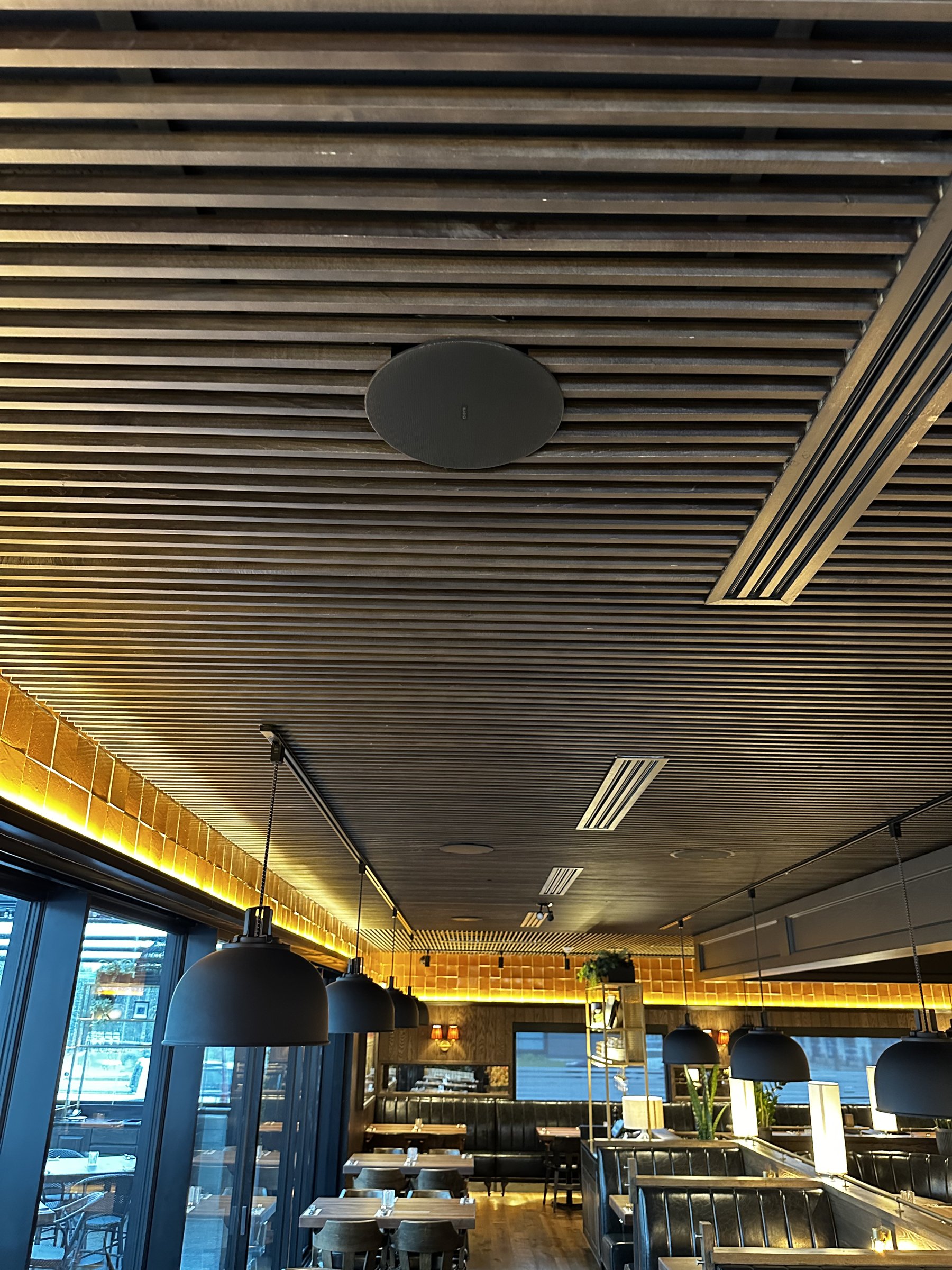 Dining zone showcasing gradual time-of-day dimming scenes