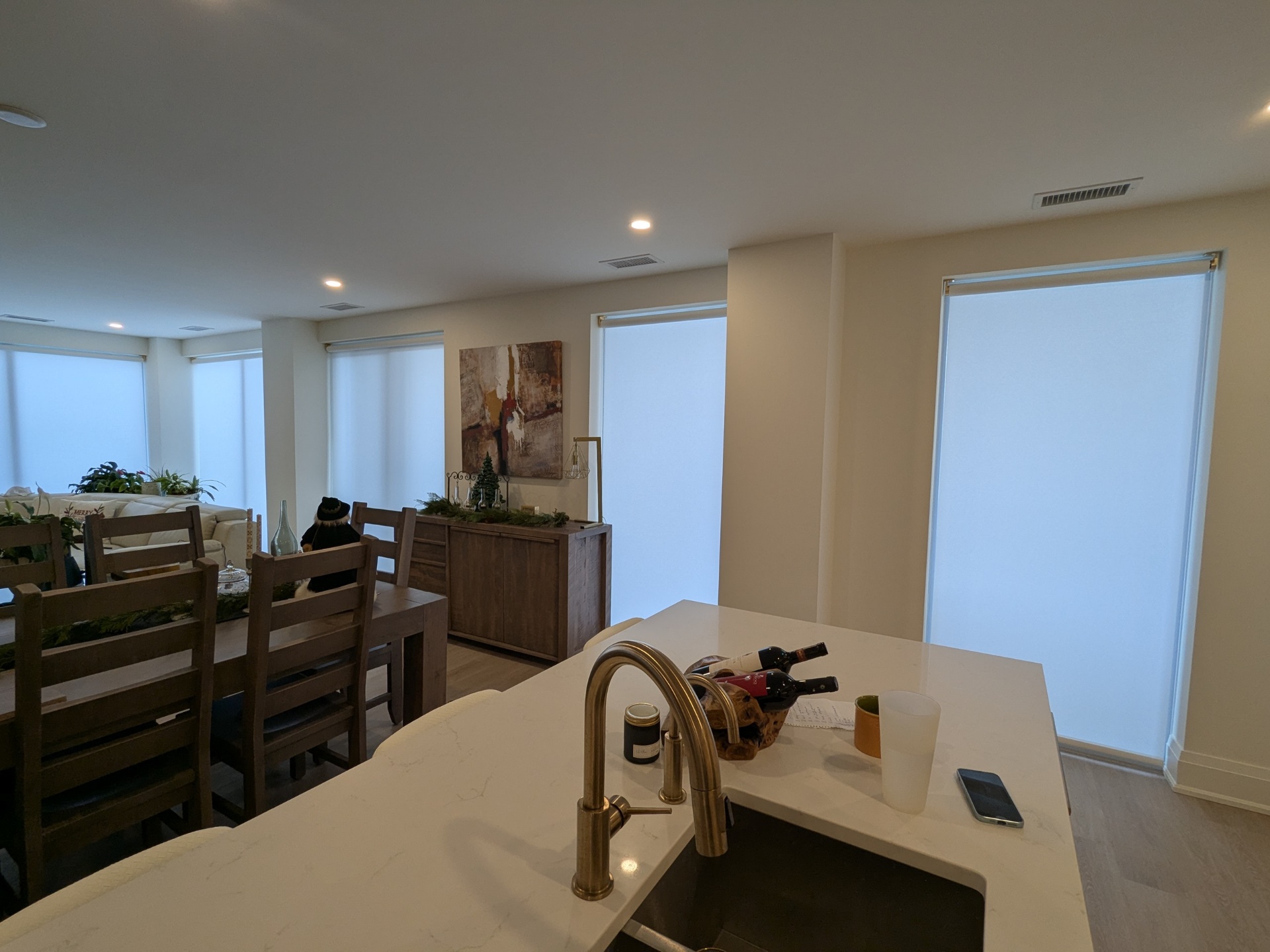 Modern condo interior with motorized shades