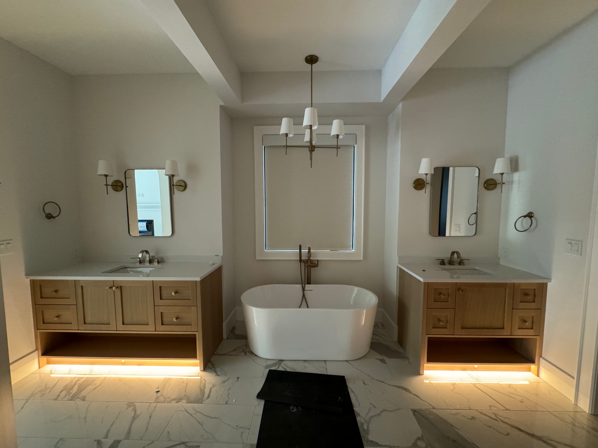 Lutron motorized shade in ensuite bathroom